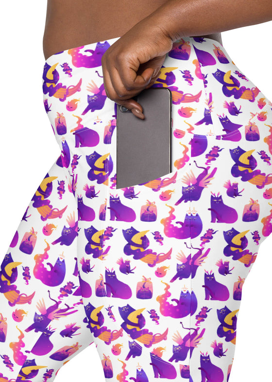 Plus-size woman highlighting the pockets of Witchy Kitties Printed White high-waist leggings. Convenient and stylish, perfect for keeping essentials close while staying comfortable.