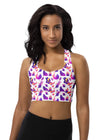 Woman wearing the Witchy Kitties White Racerback Sports Bra. Featuring a mystical cat print, high-impact support, and a racerback design for gym workouts and activewear.
