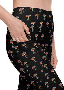  Close-up of Zen Frog black high-waisted leggings with all-over frog print and side pockets, perfect for yoga and workouts, offering comfort and functionality.