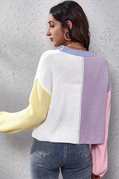 Back view of the Color Block V-Neck Knit Top, featuring a seamless color block pattern across the shoulders and sleeves.
