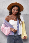 Side view of the Color Block Button Up V-Neck Knit Top, showing the relaxed fit and pastel color blocks.