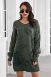 Front view of the Dinosaur Pattern V-Neck Sweater Dress in army green color with dinosaur print.