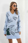 Front view of the Dinosaur Pattern V-Neck Sweater Dress in pastel blue color with dinosaur print.