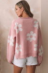 Back view of the Flower Pattern Pearl Detail Rolled Slit Sweater, showcasing floral pattern with pearl accents in soft pink.