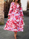 Close-up view of the Printed V-Neck Long Sleeve Midi Dress highlighting the floral pattern and V-neckline.