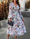 Model wearing the Printed V-Neck Long Sleeve Midi Dress in a stylish outdoor setting.