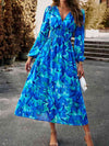 Side view of the Printed V-Neck Long Sleeve Midi Dress showcasing the ruched waist.